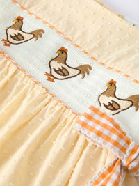Farm Girl Chicken Smocked Bow Ruffle Dress: chicken embroidery on pale blue smocked panel with peach trim.