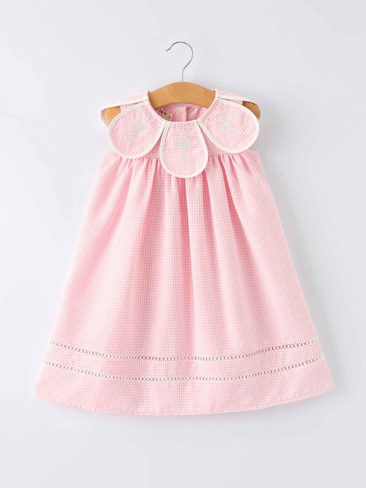 Pink gingham christening dress for girls with white cross-embroidered collar, 100% cotton.