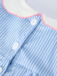 Blue striped dress with white petal Peter Pan collar, pink edge trim, and white buttons.