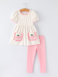 The soft fabric blend of the Back To School Girls' Apple Applique Set with Pockets, offering comfort and durability for active play.