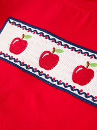 Red shirt with white apple-embroidery band and blue trim from Back To School Apple Boys Set Plaid Shorts.