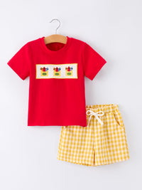 Red boys' back-to-school T-shirt with yellow smocked crayon embroidery, paired with yellow gingham shorts.