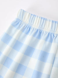 Boys back-to-school pencil plaid polo short set with elastic waistband in light blue and white fabric.