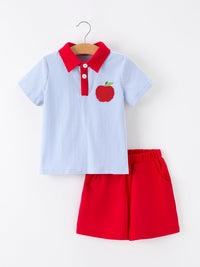 Boys back-to-school apple polo short set: blue striped polo with red collar, apple embroidery, and red shorts.