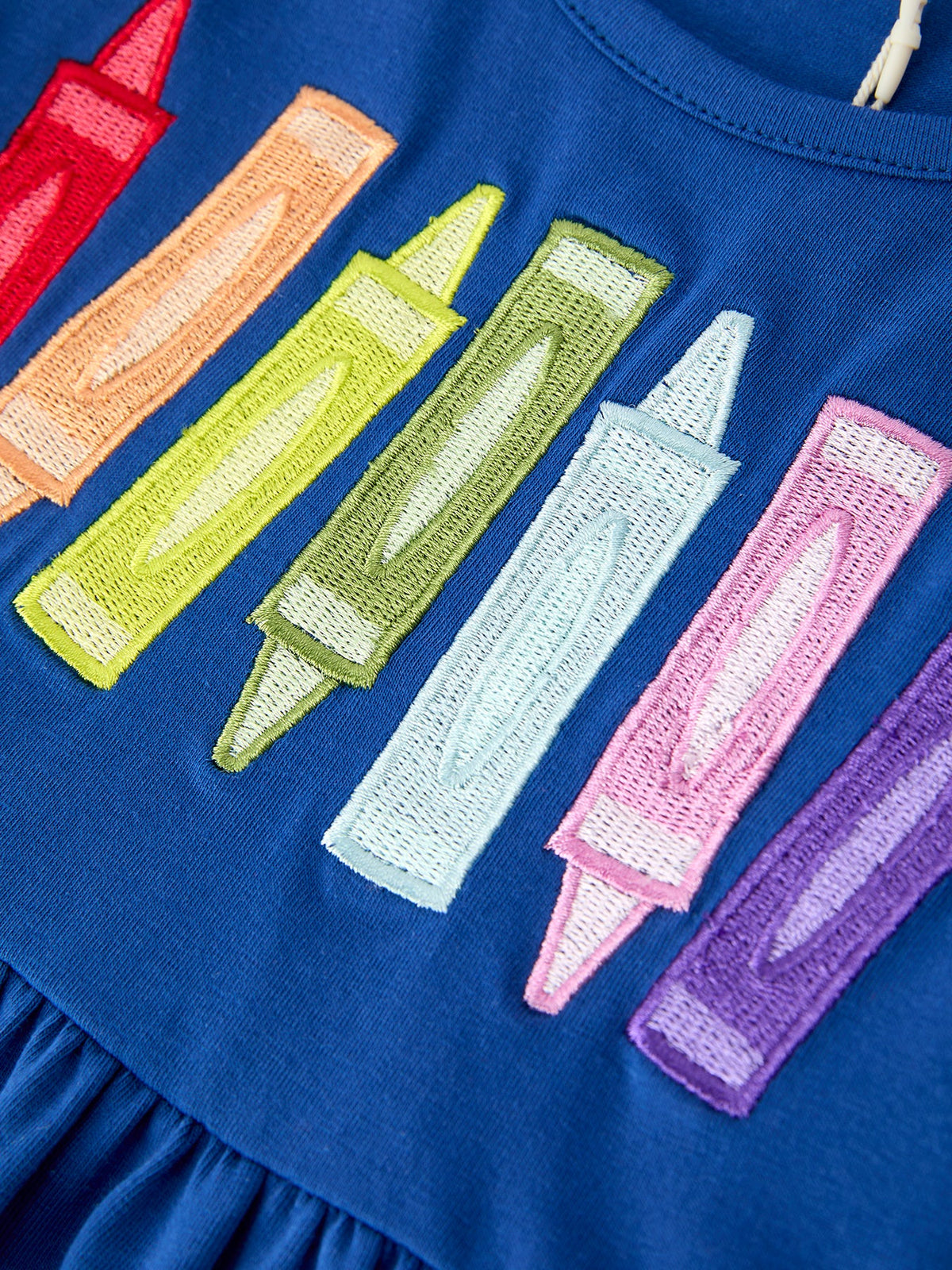 Stylish look of the Girls Back To School Crayon Twirl Dress, making it the ultimate girls back to school dress for stylish girls.