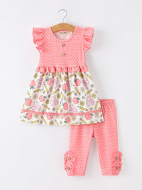 Girls pink polka-dot dress with ruffled sleeves, apple-pencil print skirt, and matching polka-dot leggings.