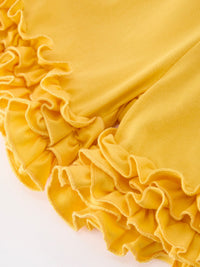 Yellow fabric with ruffled trim from Girls Back To School Pencil Bow Pocket Ruffle Top Shorts Set.