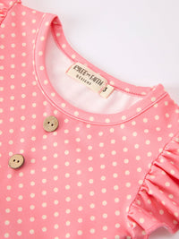 Pink polka-dot dress with wooden buttons and a ruffle sleeve by Rylee & Faith Designs for girls.