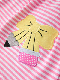 Ruffle Bow Pencil Twirl Dress on display with accessories to show its chic styling, aimed at back to school dresses.