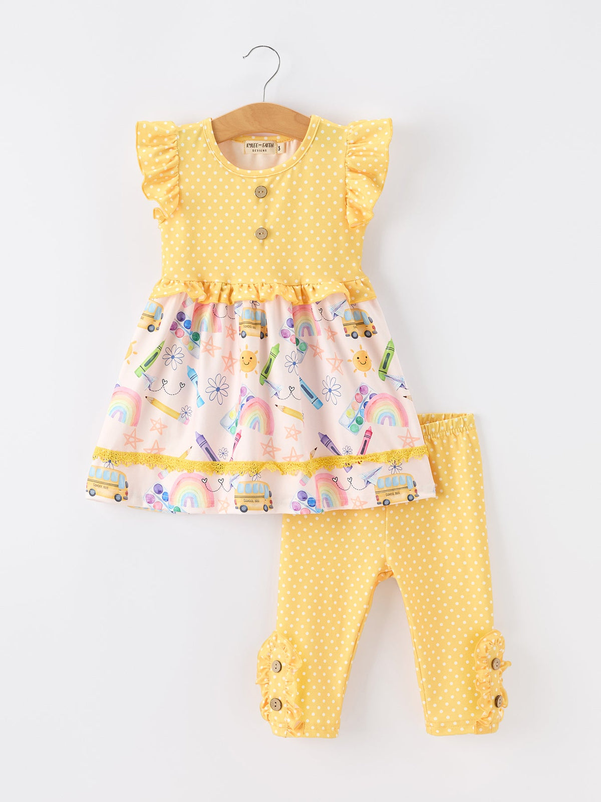 Girls Back To School Rainbow School Bus Ruffle Dress Leggings Set featuring a yellow polka-dot dress with ruffles and colorful prints, paired with matching leggings.