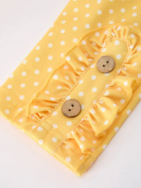 Close-up detail of the leggings from the Girls Back To School Rainbow School Bus Ruffle Dress Leggings Set, highlighting the polka-dot pattern and decorative buttons.