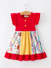 Girls Back To School Pencil Patchwork Twirl Dress with red bodice, ruffle sleeves, and colorful pencil-print skirt.