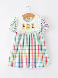 Girls plaid twirl dress with embroidered dog trio on white bib, lace trim, and pastel puff sleeves.