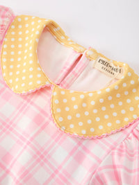 Girls back-to-school pencil plaid twirl dress with yellow polka-dot collar on pink plaid fabric