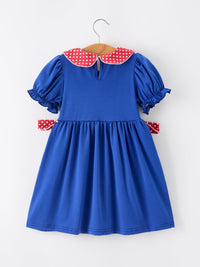 Blue girls' dress with red polka-dot apple collar, white lace trim, puff sleeves, and bow accents.