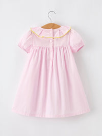 Elegant view of the Girls Back To School Dress featuring a pink pencil applique and a cute ruffle collar, perfect for school.