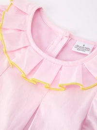 Detail of the Girls Back To School Dress - with a charming pink pencil applique and vibrant ruffle collar, designed for comfort.