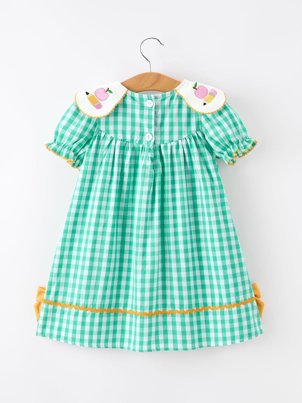 Close-up of the Back to School Apple Pencil Applique Girls Dress, showcasing charming apple and pencil designs, ideal as a back to school dress.