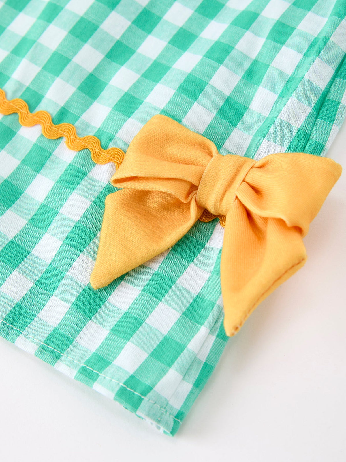 Side view of the Back to School Apple Pencil Applique Girls Dress with lovely bow details, a playful option for a back to school dress.