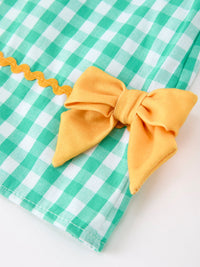 Side view of the Back to School Apple Pencil Applique Girls Dress with lovely bow details, a playful option for a back to school dress.