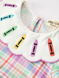 Back view of Girls School Dress with Crayon Embroidery, highlighting the stylish side bows and beautiful plaid pattern.