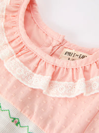 Pink girls dress collar details featuring ruffled lace petals, smocked bodice texture, and Western horse embroidery.