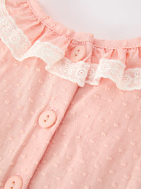 Pink girls dress bodice featuring textured cotton fabric, white lace petal collar, and matching buttons.