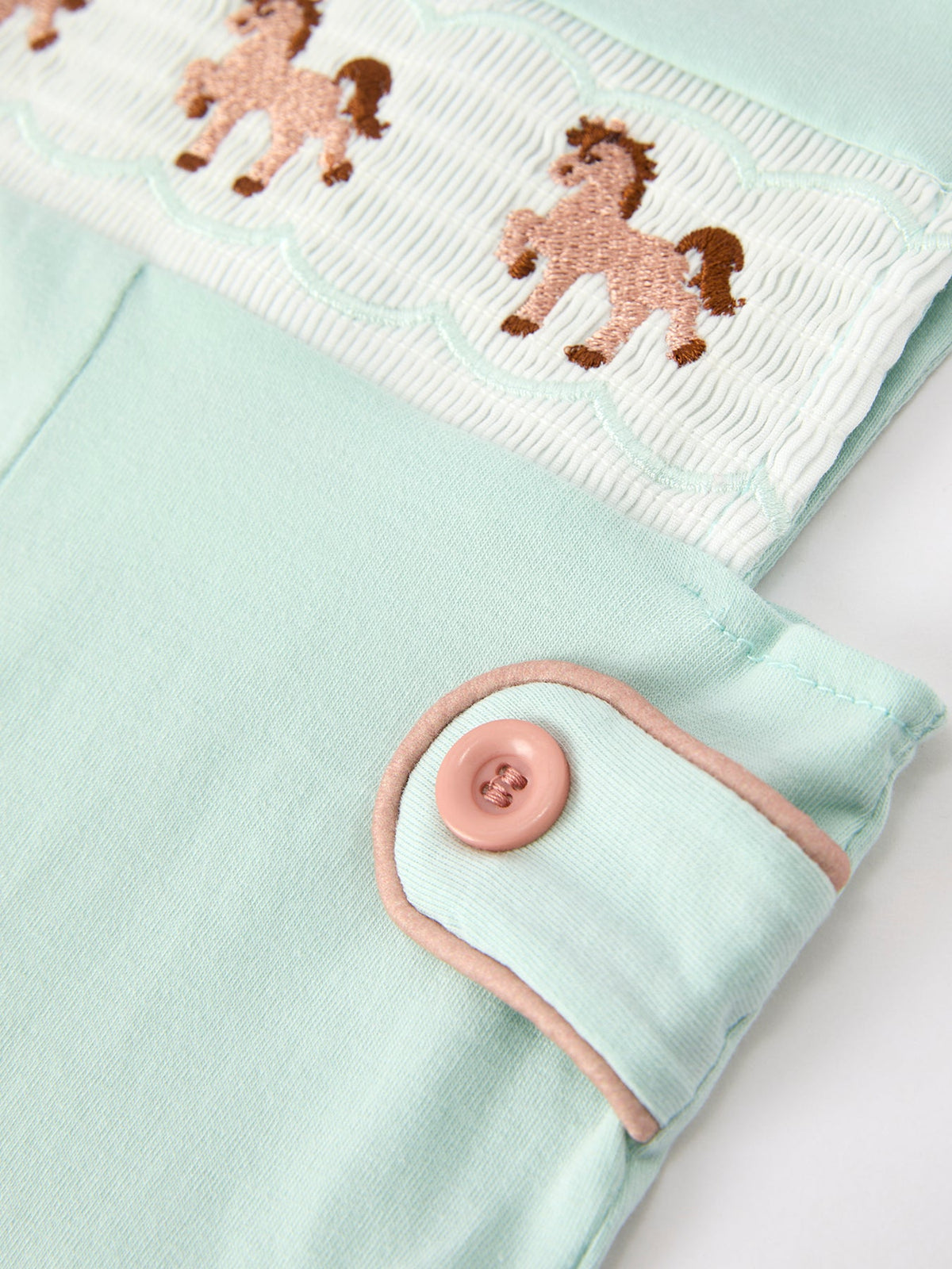 The Western Horse Embroidery Boys Jonjon Sleeveless Romper worn by a child, illustrating the cute boys jonjon style in outdoor play.