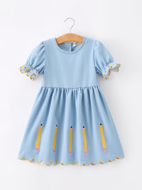 Blue dress for girls with puff sleeves, pencil appliques, and a scalloped yellow hem.
