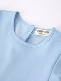 Light blue back-to-school dress for girls featuring puff sleeves, pencil applique and scallop hem.