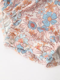 Fall Floral Baby Romper with smocked detailing and bow accents in pink-blue floral print.