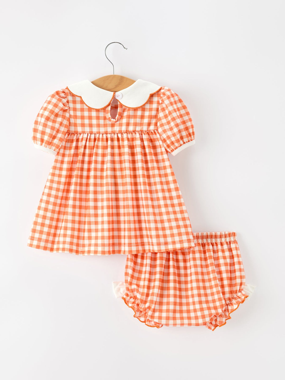 Orange gingham girls puff sleeve set with white Peter Pan collar and matching ruffled bloomers for Thanksgiving or Halloween.