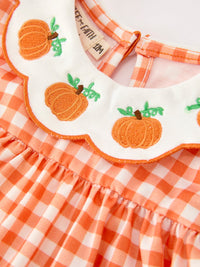 Orange gingham girls' outfit with embroidered pumpkin appliqués on scalloped Peter Pan collar, perfect for Thanksgiving or Halloween.