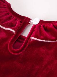 Burgundy velvet girls dress back detail featuring a white button, keyhole opening, and delicate white stitching along the neckline.