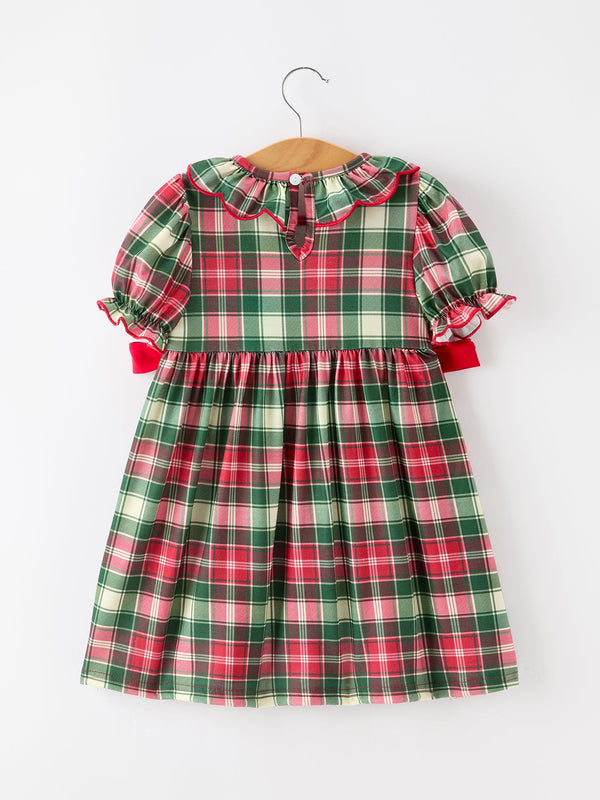 Red and green plaid girls Christmas dress with ruffle collar, puff sleeves, and bold red piping detail.