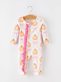 Baby girls pumpkin and pink bow print footed romper with ruffle front zipper, long sleeves, and enclosed feet for autumn wear.
