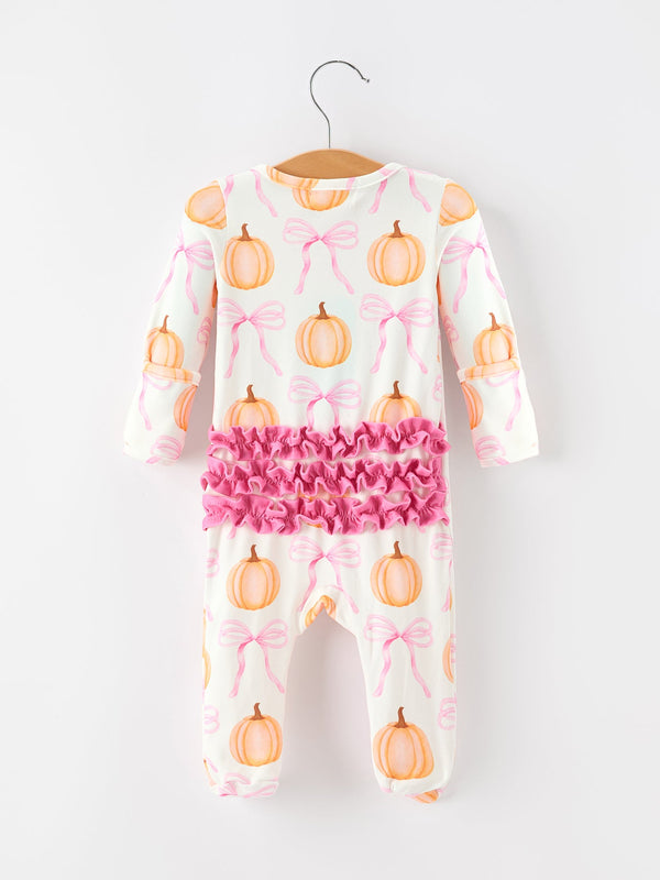 Baby girls pumpkin and pink bow print romper featuring ruffled accents across the back and enclosed feet for cozy fall wear.