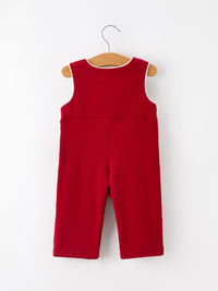 Back view of red baby boys Christmas smocked jonjon romper with white contrast piping on hanger.