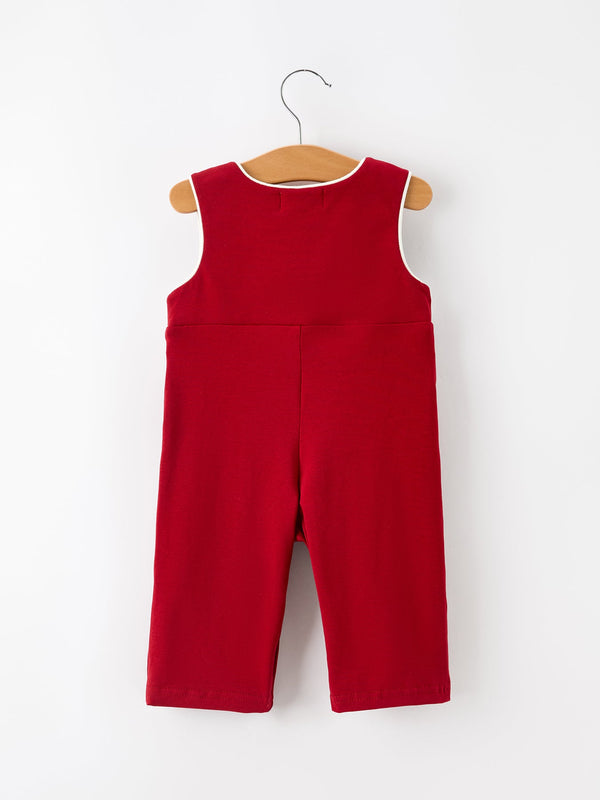 Back view of red baby boys Christmas smocked jonjon romper with white contrast piping on hanger.