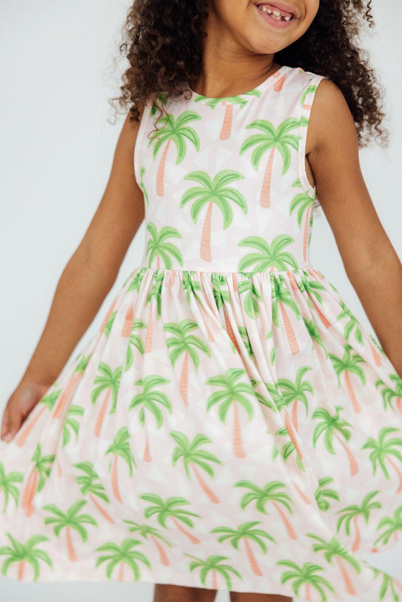 Close-up of the Breezy Beauty Tank Twirl Dress by Mila & Rose®, featuring a scoop back design for easy dressing and a modest neckline.