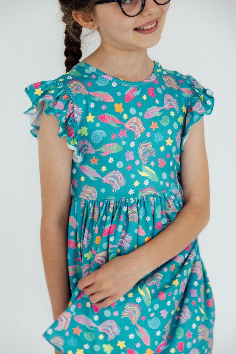 Versatile Betta Blooms Flutter Sleeve Twirl Dress styled with colorful Twirl Shorts, perfect for everyday fun.