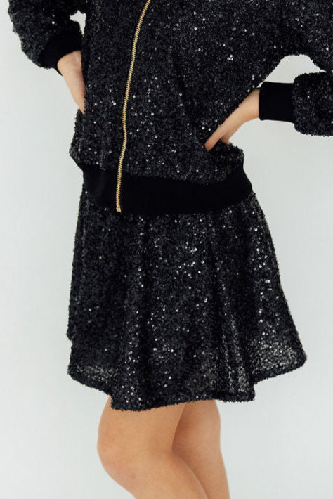 Black Sequin Twirl Skort by Mila & Rose, showcasing sparkling sequins and a playful design, perfect for twirling and dancing at parties.
