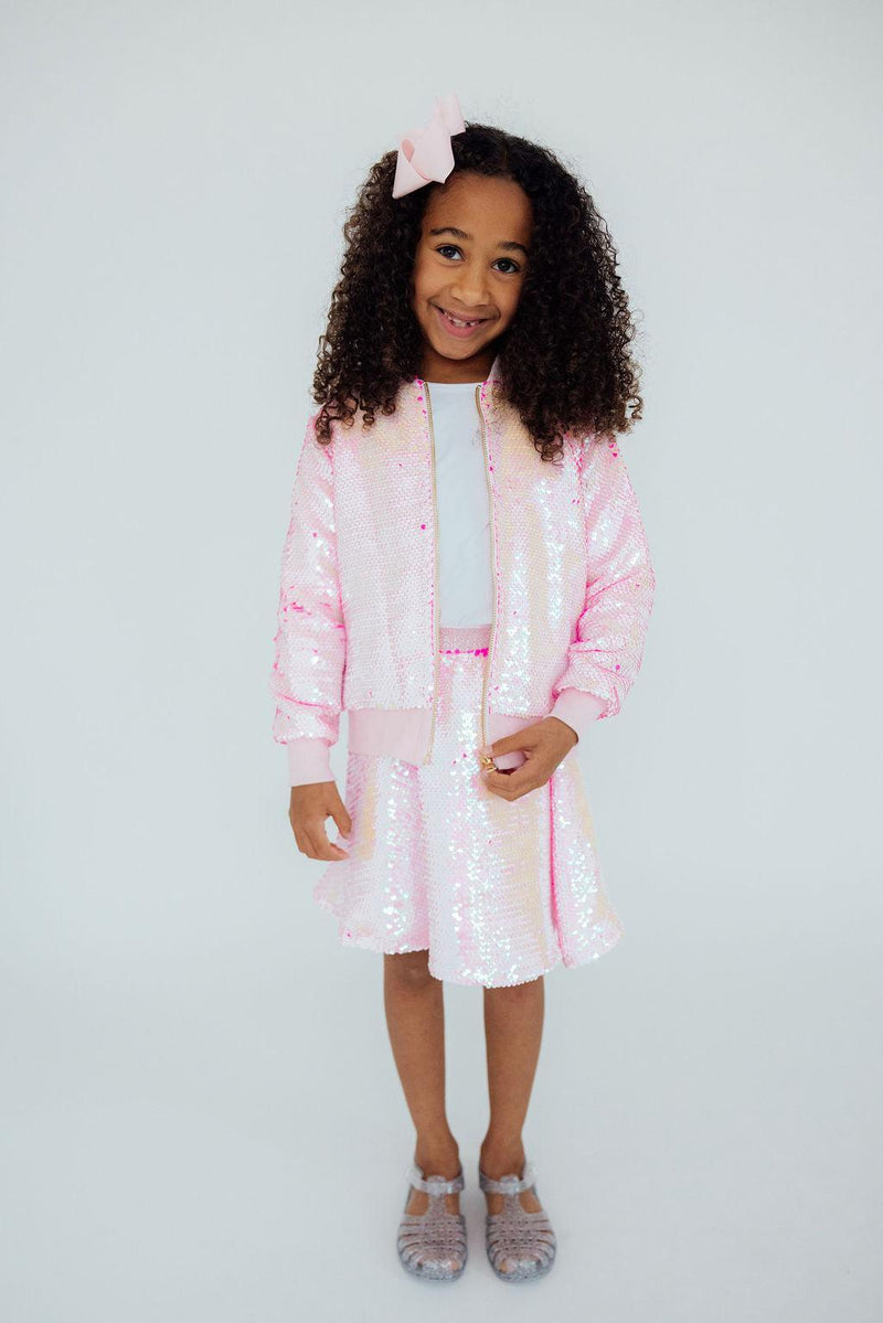 Diva Pink Flip Sequin Jacket for Girls showcasing vibrant pink sequins that flip to reveal a different color, perfect for playful fashion moments.