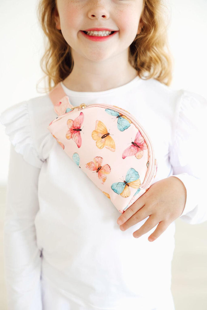 Butterfly Kisses Belt Bag - Pink by Mila & Rose, the perfect accessory for little adventurers, showcasing a cute butterfly print for adventurous playdates.