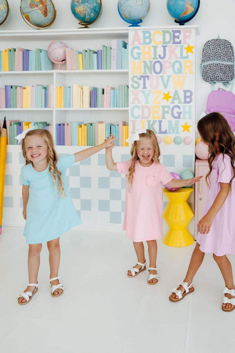 Bluebird T-Shirt Dress by Mila & Rose showcasing its adorable design with a cute ruffle pocket, perfect for active girls.