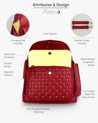Red vegan leather diaper bag with studded quilting, rose gold hardware, dual zippers, changing pad, and stroller straps.