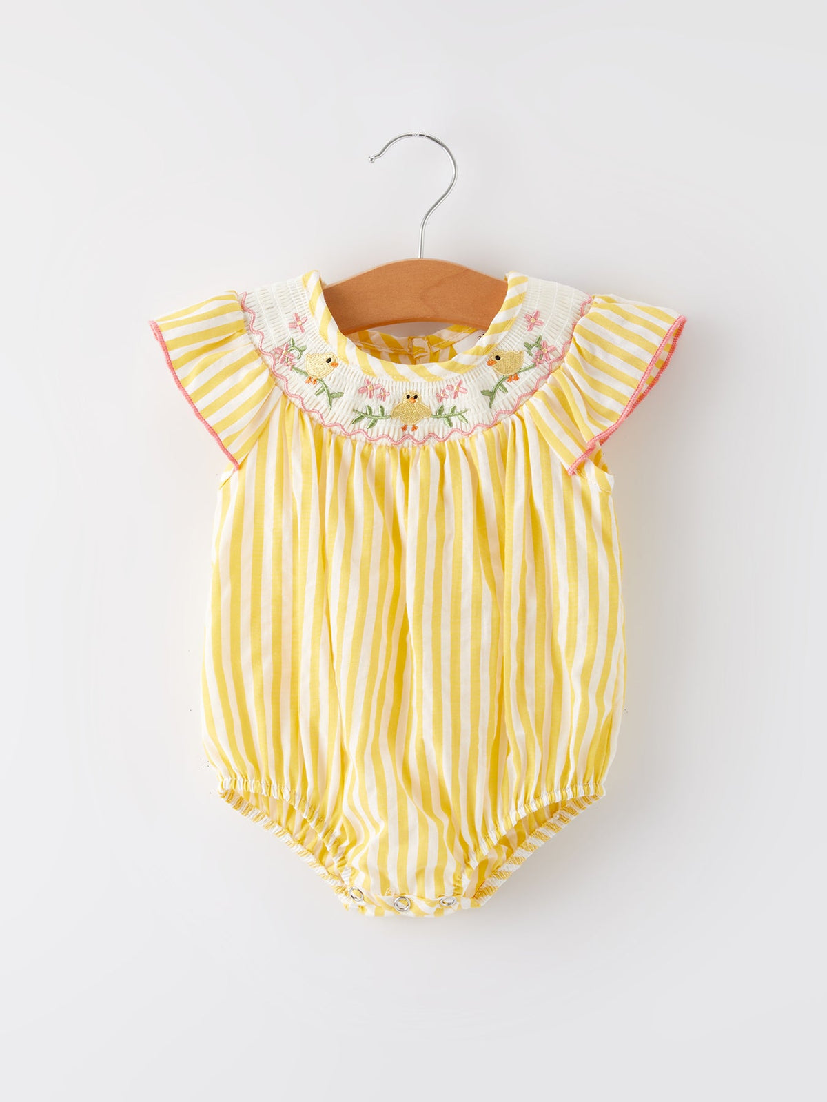 Model posing in the Spring/Summer Chick Floral Embroidery Smocking Girls Romper, exemplifying summer style and comfort.