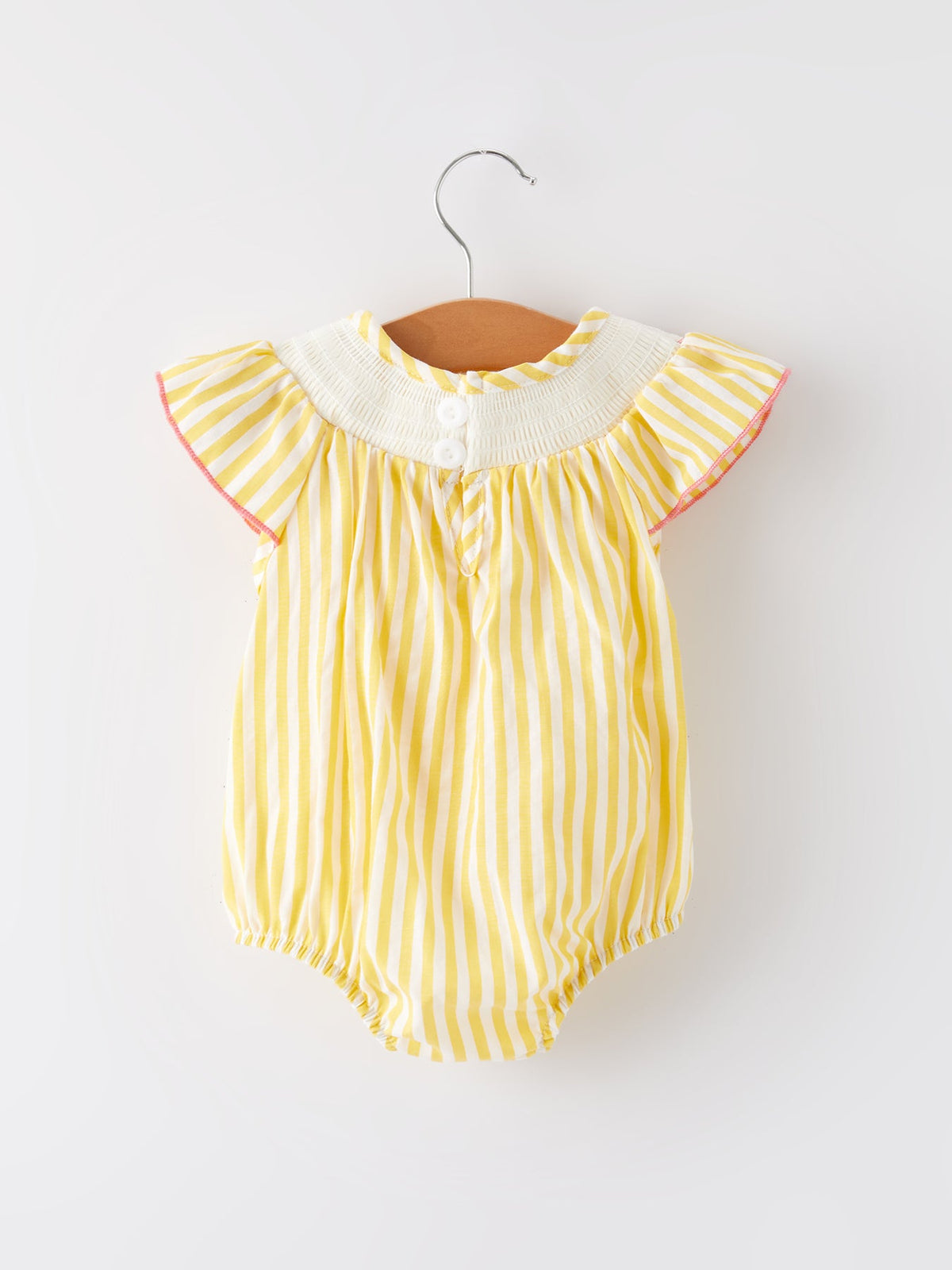 Spring/Summer Chick Floral Embroidery Smocking Girls Romper laid flat to show elegant floral patterns and breathable cotton texture.