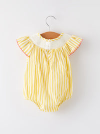 Spring/Summer Chick Floral Embroidery Smocking Girls Romper laid flat to show elegant floral patterns and breathable cotton texture.