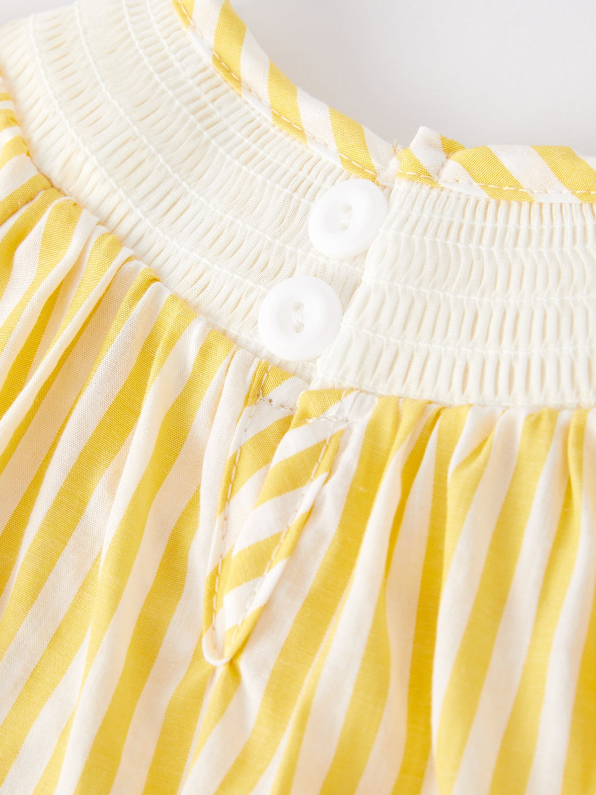 Spring/Summer Chick Floral Embroidery Smocking Girls Romper paired with summer sandals, ideal for a stylish outing.